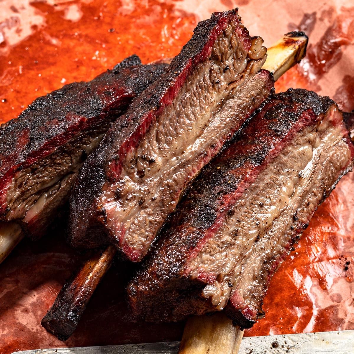 Giant smoked beef ribs with dark bark and a juicy centre