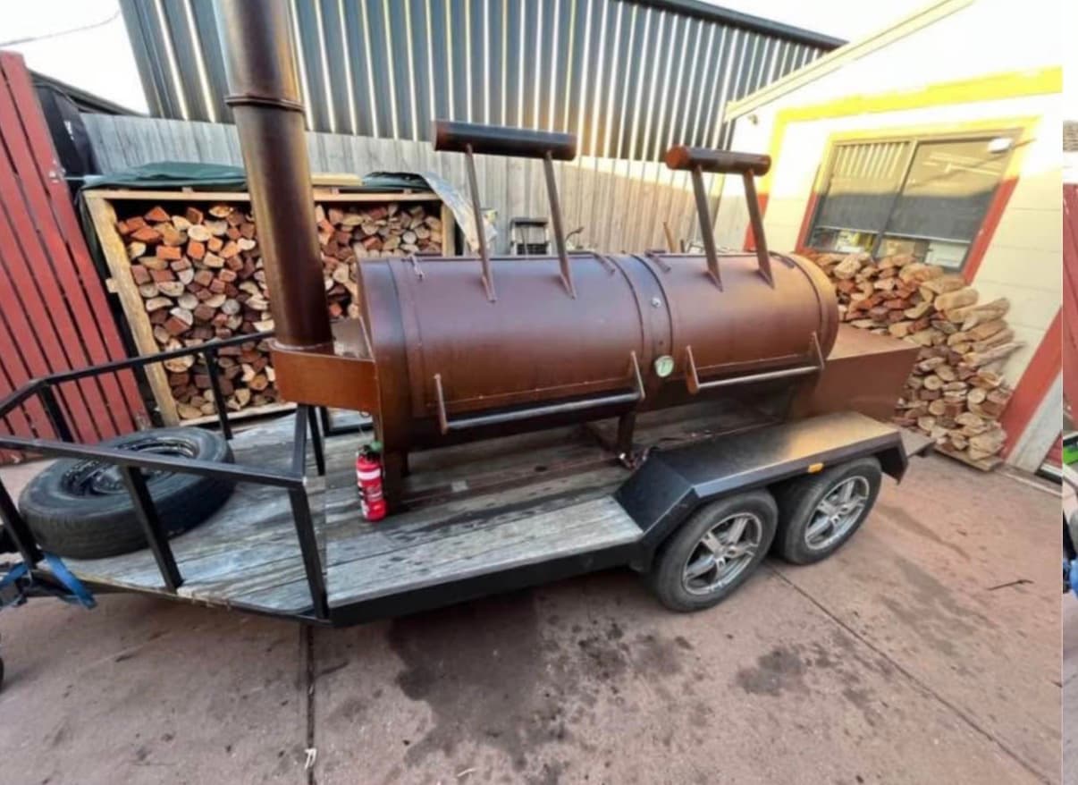 Smokehouse station setup for an American BBQ catering experience